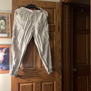 Tan cargo pants cropped at ankles